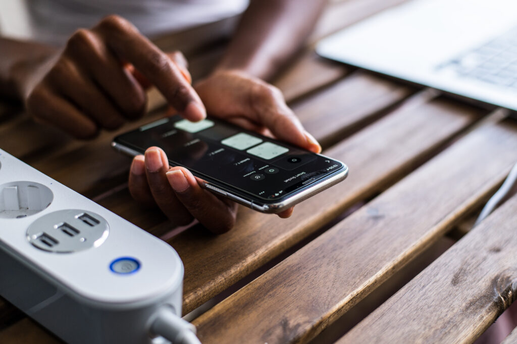 Black person setting configuration of smart home